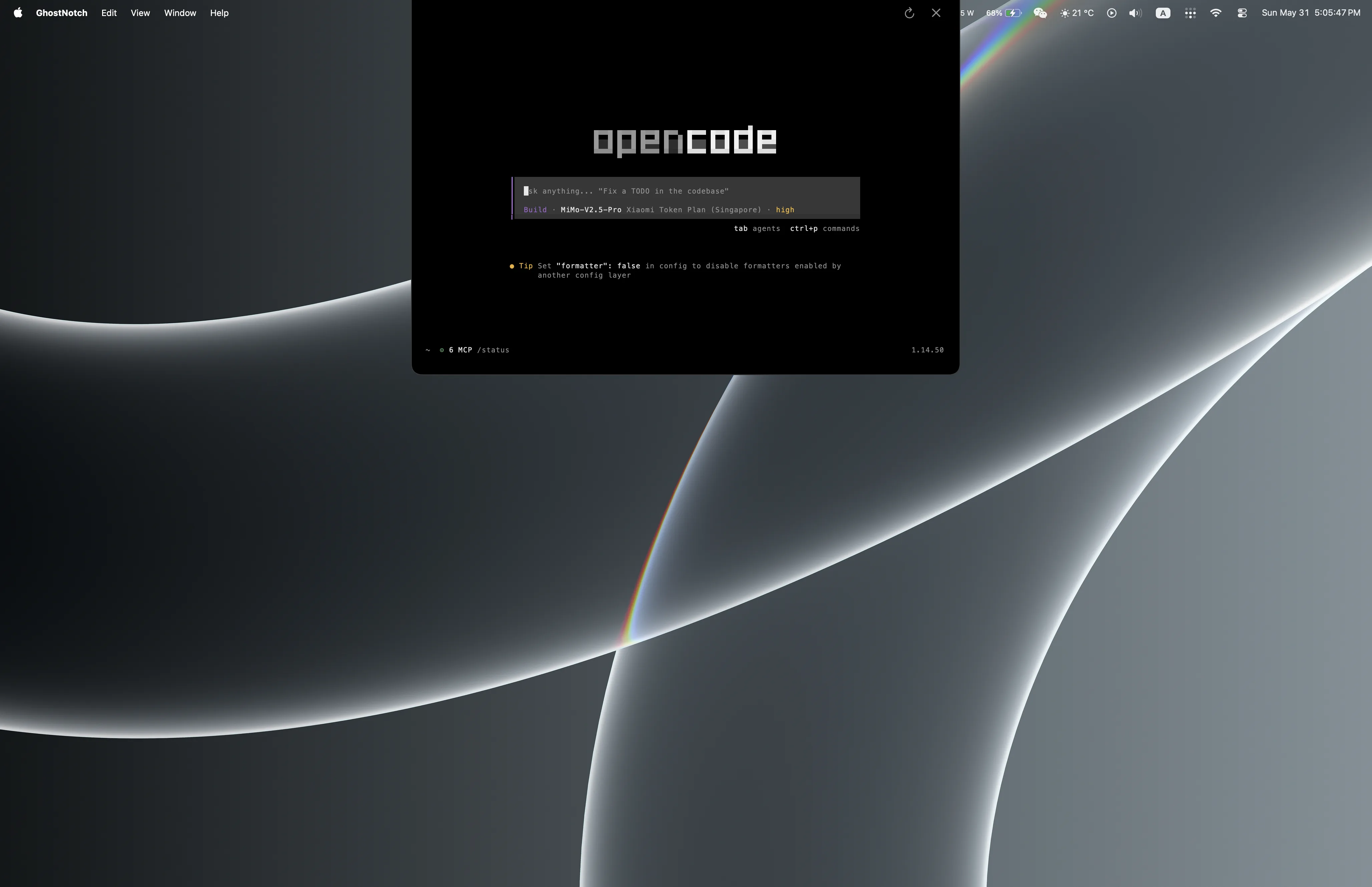 GhostNotch expanded as a compact terminal island below the MacBook notch.